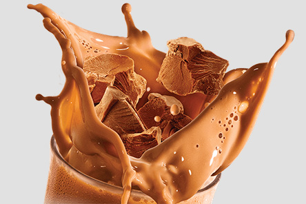 Chocolate splashing in cup